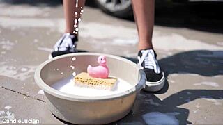 Teens washing a Mercedes car outdoors with long hair