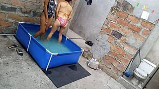 An athletic Indian woman and a curvy Latin woman enjoy a vacation by the pool as the sun warms their bodies.