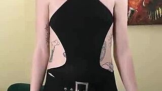 Kit Summers in black bodysuit and gothic miniskirt