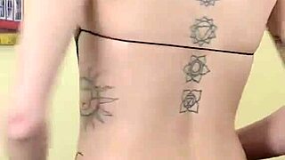 Kit Summers in black bodysuit and gothic miniskirt