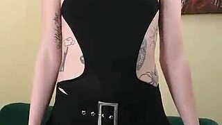 Kit Summers in black bodysuit and gothic miniskirt