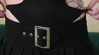 Kit Summers in black bodysuit and gothic miniskirt