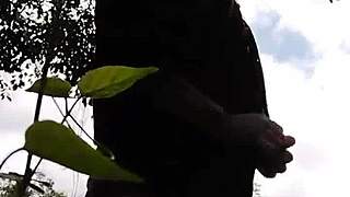 Young woman enjoys to perform erotic shows for men in the woods