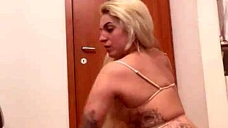 so erotic with tattooed blonde in sensual scene.