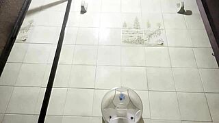 A fat woman with a big ass enters the bathroom