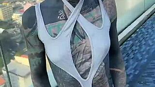 Bikini model lounges by the pool on Pattaya's rooftops