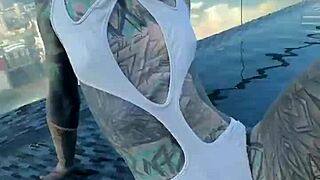 Bikini model lounges by the pool on Pattaya's rooftops