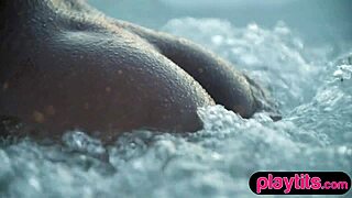 petite ebony milf strips to expose her juicy round tits in a pool 😍