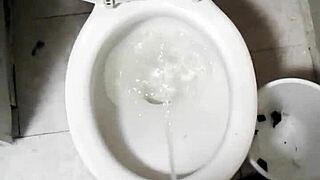 a nude model in the shower sees a picture that causes her to piss uncontrollably, leading to a messy bathing scene