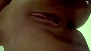 Is This Latina Beauty Teasing Her Juicy Pussy with a Dildo in Her Bedroom Close-Up?