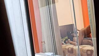 Is my Colombian neighbor fucking her boyfriend while being watched voyeur style?
