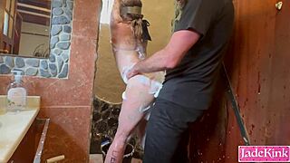 Sub slut endures rough bathroom punishment with foam spray