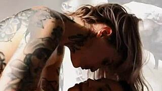 Tattooed skin glows during intense massage session