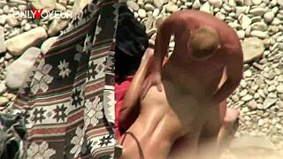 hey watch this couple bang on public beach doggystyle voyeur style