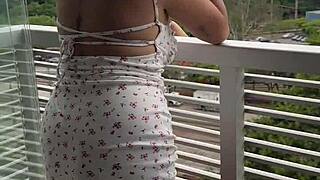Curvy brazilian squirts on balcony toy as neighbor spies wet pussy