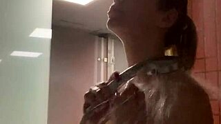 cute girl with amazing body relaxes in shower after gym workout