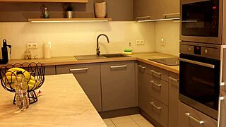 check out this long-legged blonde coed's miniskirt barely hiding ass in heels 🔥 kitchen tease!