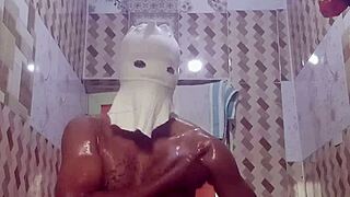 A young woman indulges in erotic solo masturbation in the bathroom.