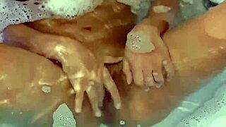 Latina teen fingers perfect body to orgasm in tub