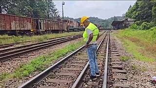 workers fix railway line with heavy labor as passive colleague bends over tracks in teaser
