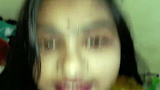 in a dimly lit room the busty indian bhabhi surrenders to her devar's touch leading to passionate homemade desi sex filled with moans