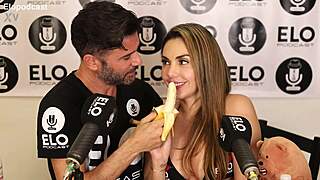 beautiful model devours whole banana topped with cream
