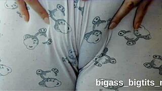 Watch this curvy European milf finger her fat pussy through pajamas showing off that cameltoe