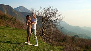 horny couple fucks on mountain meadow