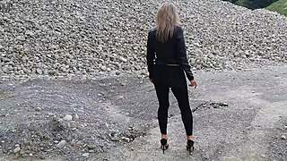 grandma walks around gravel pit in tight leggings
