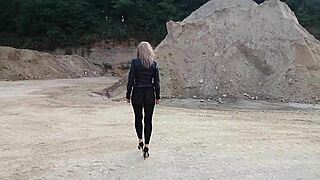 grandma walks around gravel pit in tight leggings